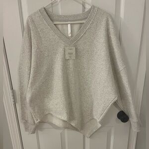 Fabletics Forever Fleece Asymmetrical Sweatshirt- Soft Gray Heather/Gravity Gray